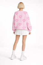 Back pose of the model wearing Heart Shape Bubble Sleeve Baggy Sweater