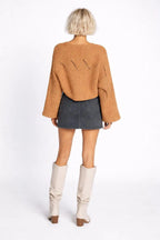 Back pose of the model wearing Hollowed Detail Wide Sleeve Loose Pullover Sweater