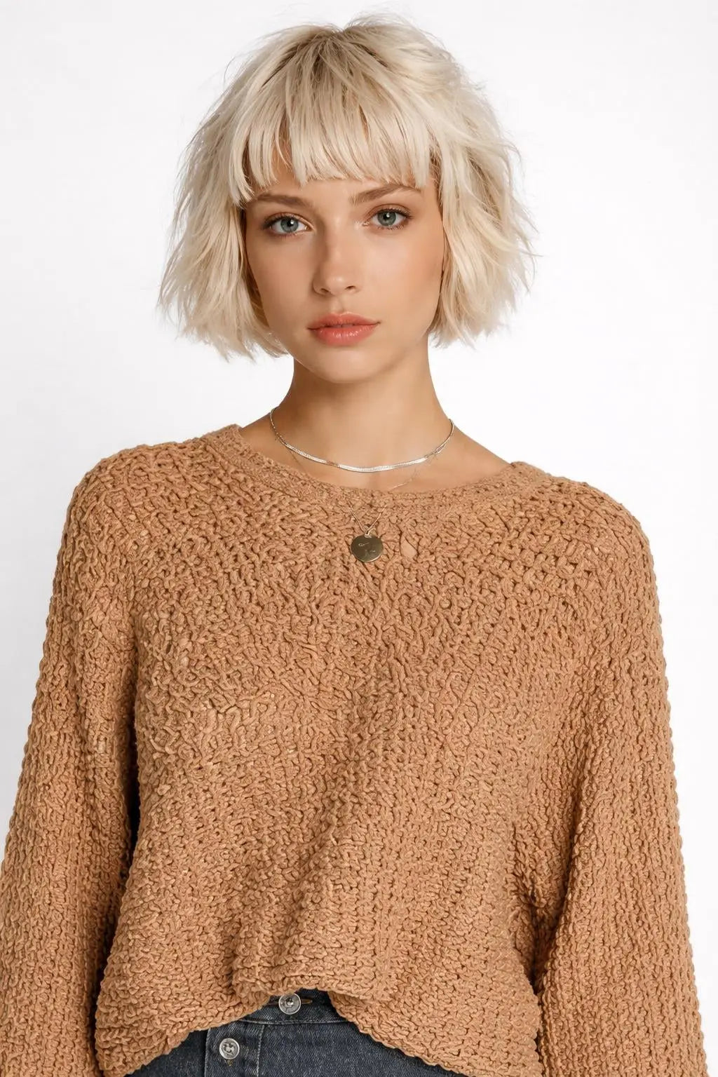 Close-up of the model wearing Hollowed Detail Wide Sleeve Loose Pullover Sweater