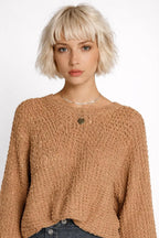 Close-up of the model wearing Hollowed Detail Wide Sleeve Loose Pullover Sweater