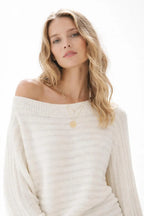 Close-up of the model wearing One Shoulder Ribbed Knit Sweater