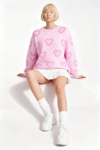 Model sitting while wearing Heart Shape Bubble Sleeve Baggy Sweater